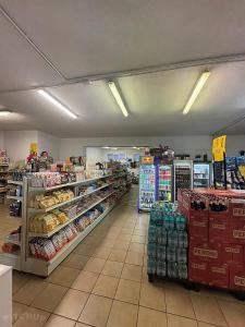 a store aisle of a grocery store with a lot of products at Camping Internazionale Di Castelfusano in Lido di Ostia