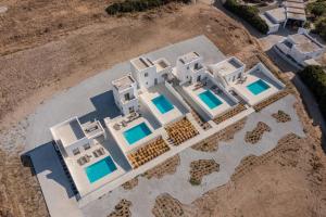 an aerial view of a villa with white buildings at Eupnoia Villas in Agios Arsenios