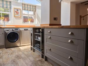 a laundry room with a washer and dryer at 27 West Green in Newton Aycliffe