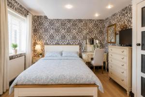a bedroom with a bed and a desk at K Suites - Liverpool Road Worcester with Hot Tub in Worcester