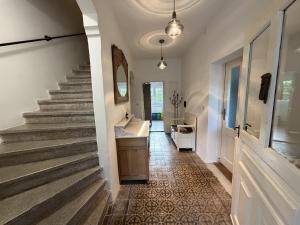 a hallway with stairs and a sink in a house at Wellness Chalet Luby in Luby +79 photos