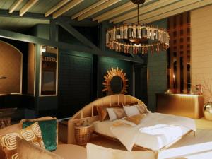 a bedroom with a bed and a chandelier at Oaga Art Resort Maldives - All Inclusive in North Male Atoll