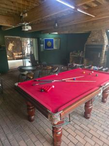 a pool table with balls on top of it at Nguni Gaste Huis in Mooinooi