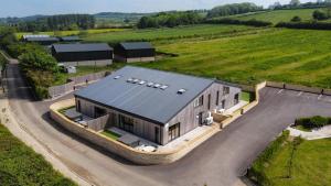 an overhead view of a large house in a field at Bears Court in Cheltenham