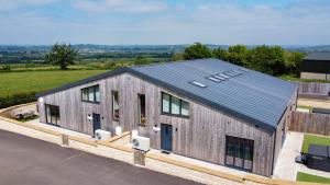 an overhead view of a metal building with a solar roof at Bears Court in Cheltenham