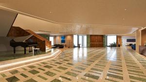 a living room with a grand piano and a living room at The Nishat Hotel Margala in Islamabad