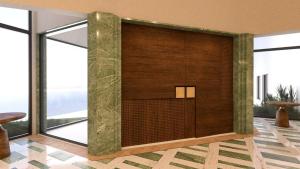 a lobby with a wall of glass windows at The Nishat Hotel Margala in Islamabad
