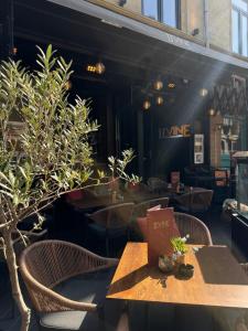 a restaurant with tables and chairs and plants at vakantie appartement D'vine in Valkenburg