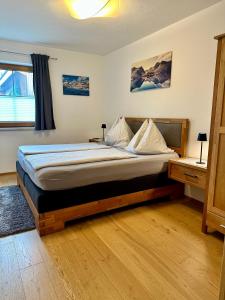 a bedroom with a large bed in a room at Ferienwohnung am Lindenweg in Brixen im Thale