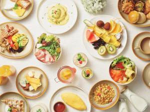 a white table with plates of food on it at ANA InterContinental Ishigaki Resort by IHG in Ishigaki Island