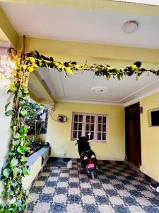 a room with a motorcycle parked in it at Sumitra Niwas-Home Away from Home in Bālāju