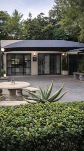 a building with a table in front of it at Bella Rosa in Potchefstroom