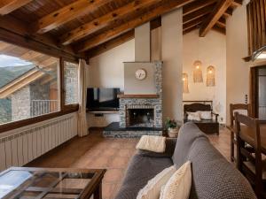 a living room with a couch and a fireplace at Casa Jonico in Montardit