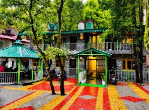 a building with a colorful rug in front of it at The Woods Boho in Nainital