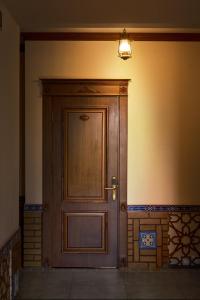 a wooden door in the corner of a room at Platan in Samarkand