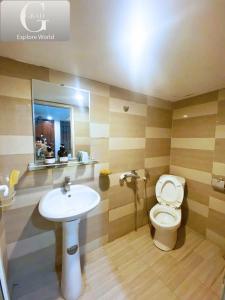 a bathroom with a toilet and a sink at Hanoi Gold Hotel Near Bach Mai in Hanoi
