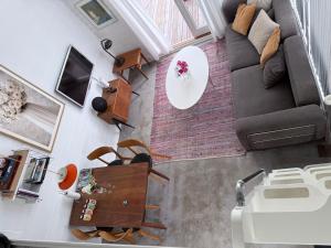 an overhead view of a living room with a couch at Harbor Breeze & Garden Peace in Åhus