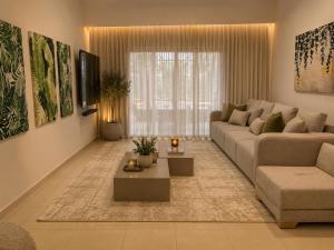 a living room with a couch and a table at וילה נחל טביה in Arad