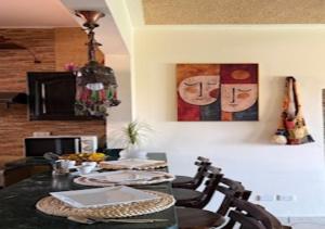 a dining room with a table and chairs at Luxury Chalet - La Hacienda in Ras Sedr