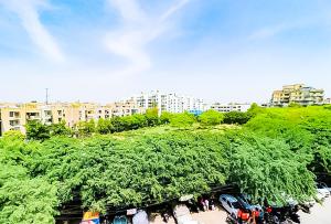 a group of cars parked in a parking lot at Hotel Goldwind stay - Near Karkardooma Metro in New Delhi