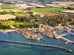 an aerial view of a harbor with boats in the water at Møn - Klintholm Harbour in Borre
