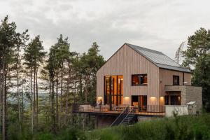 a house in the middle of a forest at Les Terrasses de Durbuy in Durbuy +28 photos