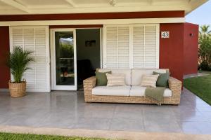 a wicker couch sitting on a patio at Albaricoques Sun & Beach in Maspalomas