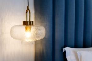 a close up of a light fixture in a bedroom at San Marco Hotel and Villas in Houlakia