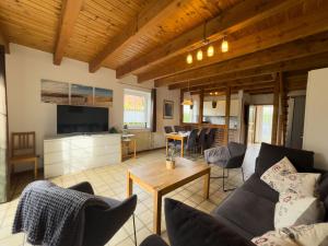 a living room with a couch and a table at Tegeler Plate 26 in Wangerland