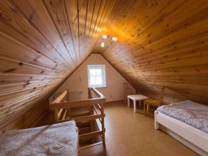 a attic room with a large wooden ceiling at Tegeler Plate 26 in Wangerland