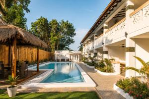 an image of a swimming pool at a resort at Alona Garden Suites in Panglao Island