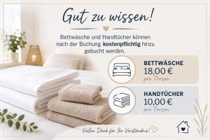 a bunch of towels on a table in a bedroom at Tegeler Plate 26 in Wangerland +29 photos
