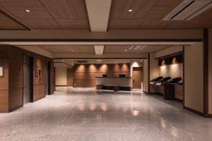 a lobby with a piano in a building at Hotel New Green Plaza in Nagaoka