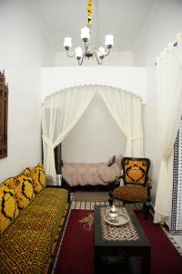 a living room with a couch and a tent at Dar Mhani in Salé