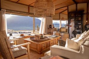 a living room with a view of the ocean at Wolwedans Desert lodge in NamibRand