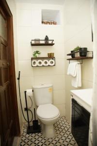a bathroom with a toilet and a sink at Dar Mhani in Salé