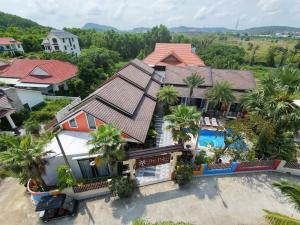 an aerial view of a house with a swimming pool at The Palm Phu Quoc Resort & Villa in Phú Quốc