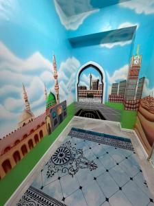 a room with a mural of a mosque at Meridian Hotel in Georgīevka +24 photos