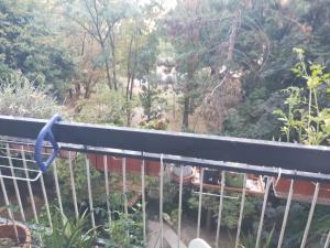 a balcony with a view of a garden at Focolare domestico in Milan