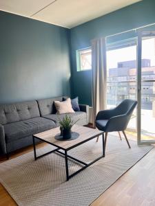 a living room with a couch and a table at City apartment in Alta