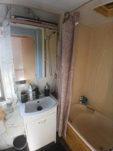 a bathroom with a sink and a bath tub at DanowskieCamp in Danowskie +18 photos
