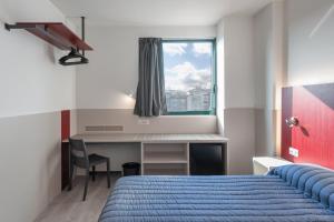 Posteľ alebo postele v izbe v ubytovaní Hotel Porta Palio