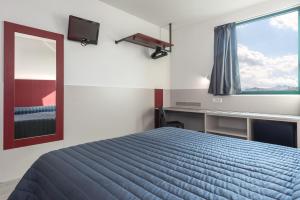 Posteľ alebo postele v izbe v ubytovaní Hotel Porta Palio