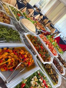 a buffet of different types of salads and vegetables at Hotel Como in Rimini