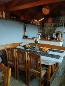 a dining room with a table and chairs at Chata Monika Veľké Pole in Veľké Pole