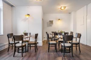 a dining room with tables and chairs at Signature Hotel Astoria in Hamburg