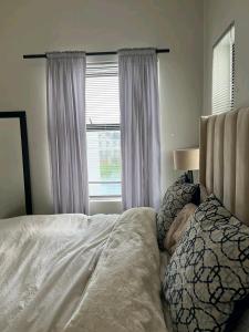 a bedroom with a bed and a window at Ocean view in Johannesburg