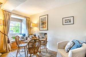 a living room with a table and chairs and a couch at 3 Bed in Askrigg oc-ds779 in Askrigg
