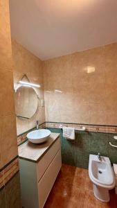 a bathroom with a sink and a toilet at Casa Laiglesia in Uncastillo +44 photos