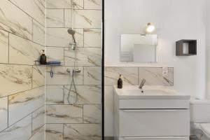 a bathroom with a sink and a shower at Maison entre foret et mer in Millebosc +23 photos